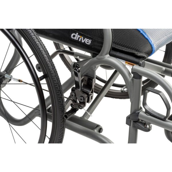 An-ultra-lite-manual-wheelchair-being-maneuvered-smoothly-on-an-outdoor-paved-walkway-in-Ontario-motion-care-mobility-inc.